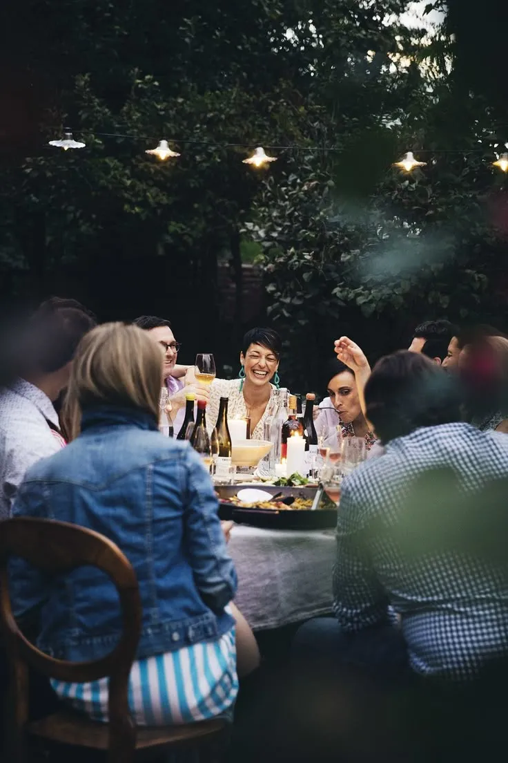 Dinner with friends around a table outdoors
