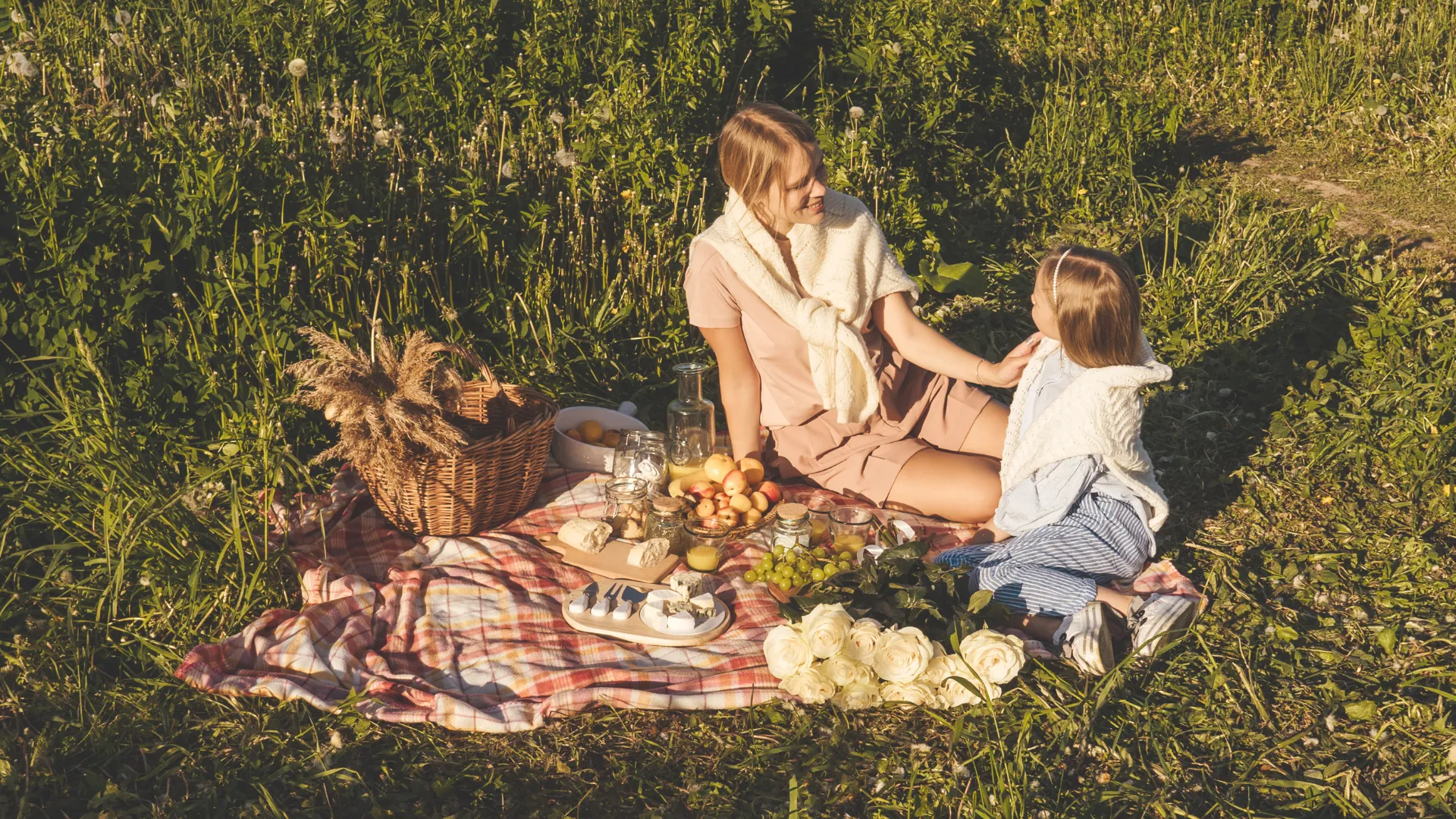 Happy family in the woods, having a picninc